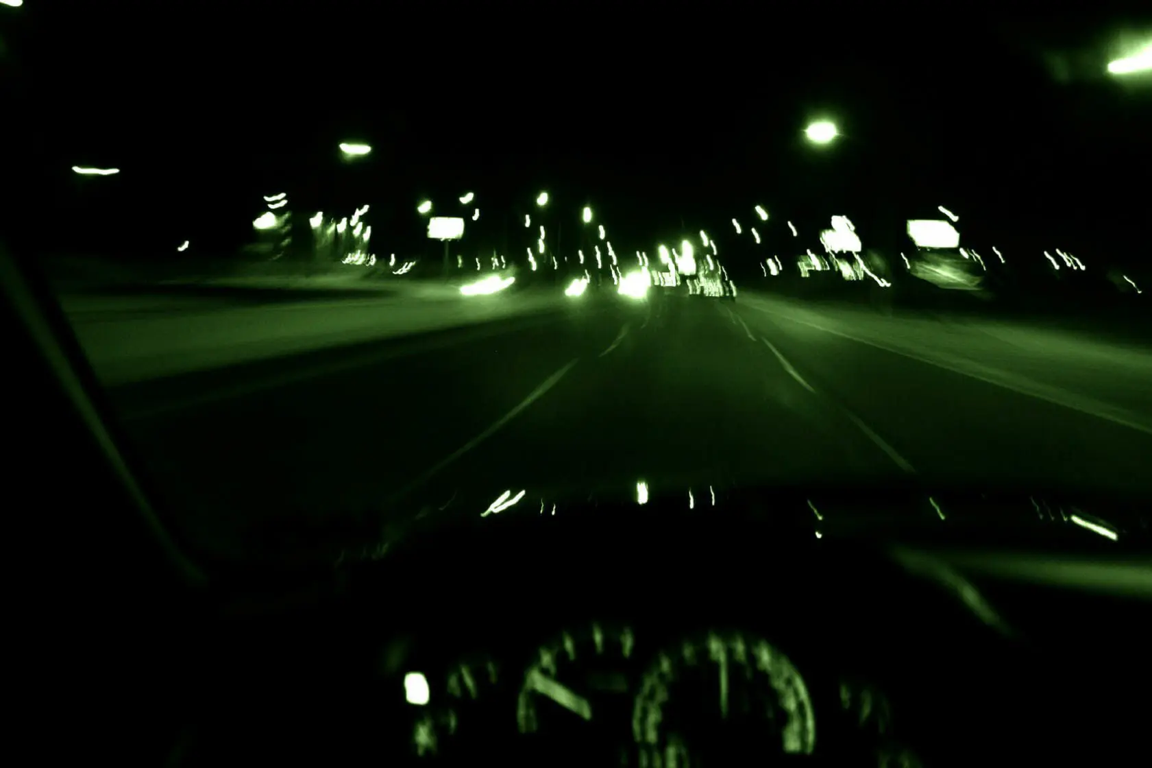 Family of Four Hospitalized Following San Antonio Crash 1 Blurry green tint image of driving
