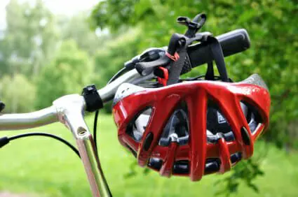 Garbage Truck Hits and Kills Bicyclist 1 Red helmet hanging off a bicycle handle