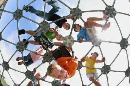What Parents Need to Know About Playground Brain Injuries 1 Kids playing on jungle gym