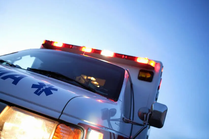 At Least 1 Dead, 99 Unaccounted for After Building Collapse in Surfside, Florida 1 Close-up of ambulance truck