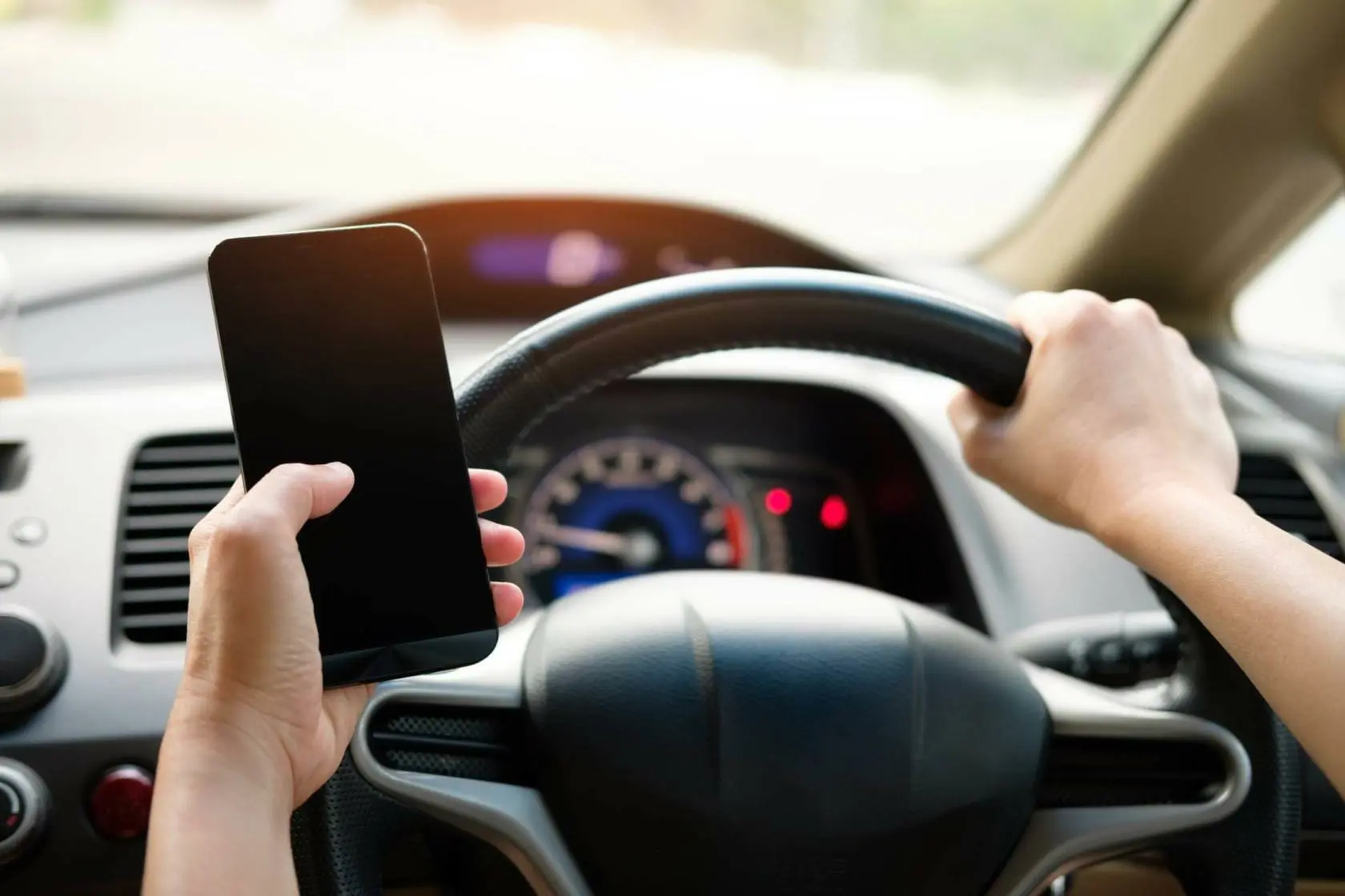 Blog 9 Driver holding cellphone while driving