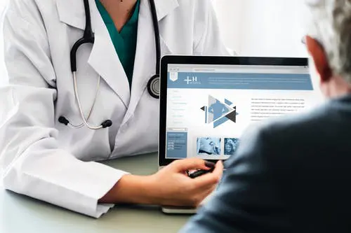 Blog 9 Doctor reviewing information on tablet to patient