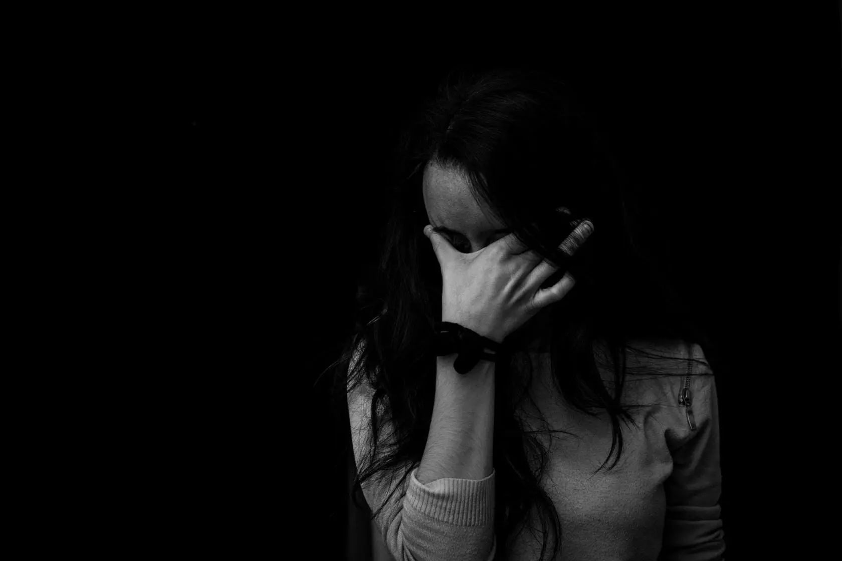 Blog 13 Young woman with head in hands