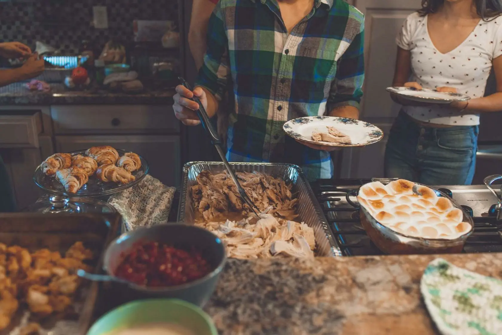 Blog 11 Family serving Thanksgiving dinner
