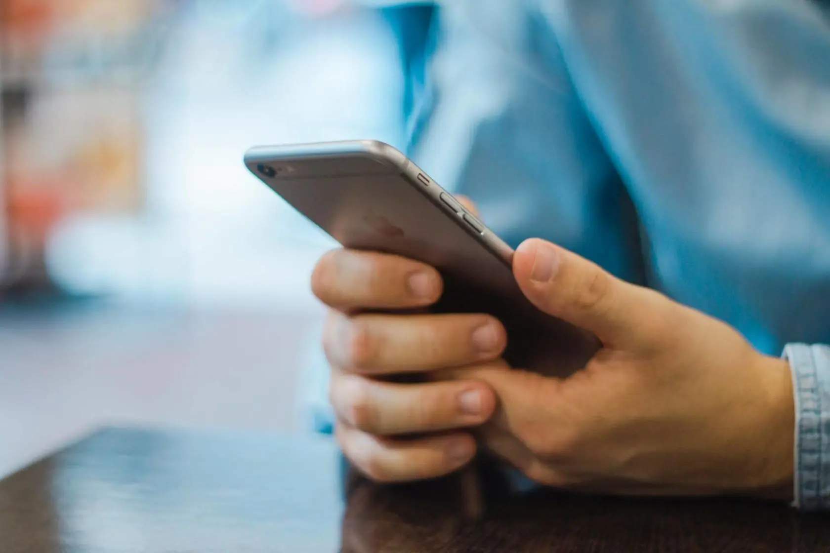 Blog 15 Man texting on iPhone