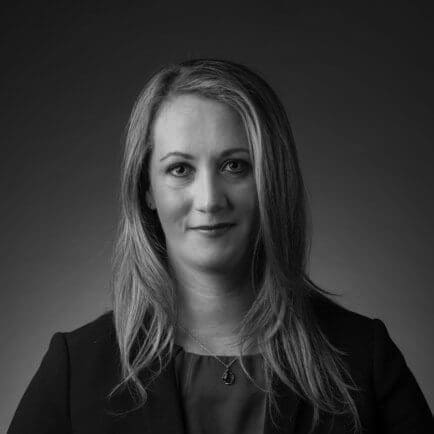 Black and white portrait photo of Thomas J. Henry Attorney Laurie Dobson