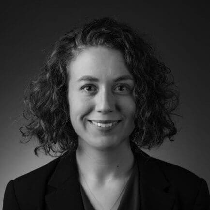 Black and white portrait photo of Thomas J. Henry Attorney Lesley Paniszczyn