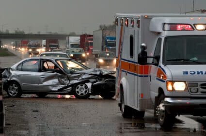 Two Killed in Rusk County Log Truck Accident 1 Damaged car from an accident with responding ambulance