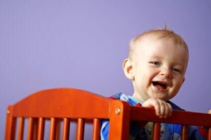 Blog 9 Baby boy smiling in crib