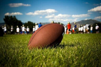 Football in grass field
