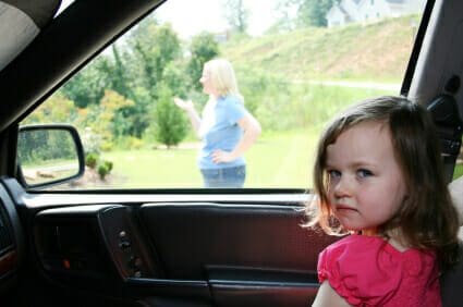 Child waiting in the car for mother