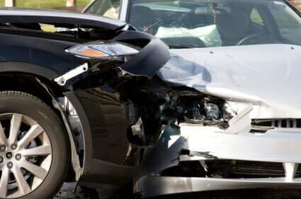 Black and white vehicles in car crash