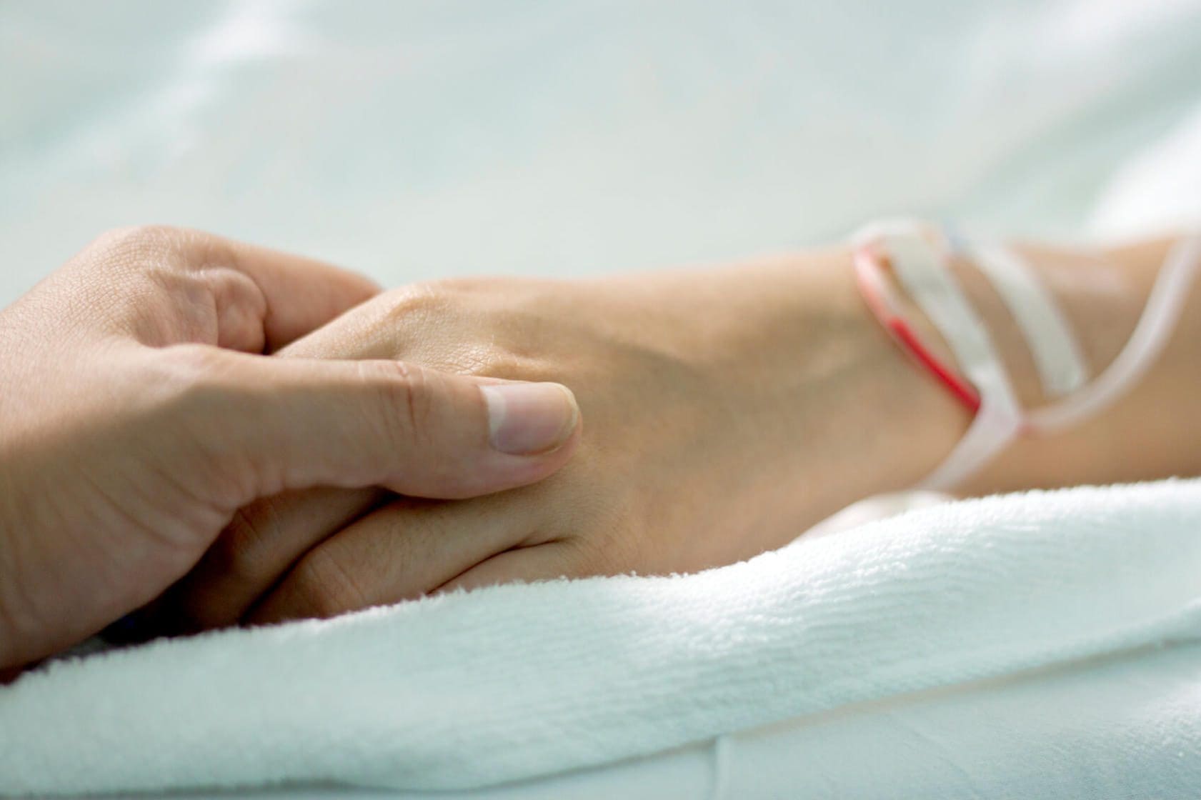 Rear-End Collisions in Texas: Who's Really at Fault? 16 Hand holding patient