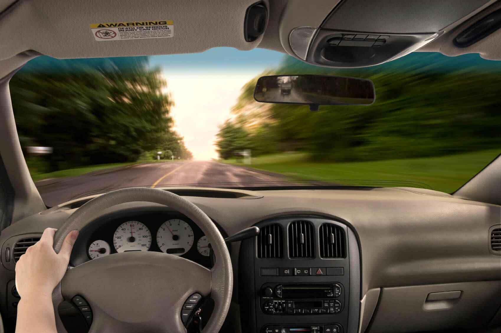 Is it Safe to use a Hands-free Device to Talk on a Cell Phone while Driving? 1 First person view of driver in a car looking out through the front window