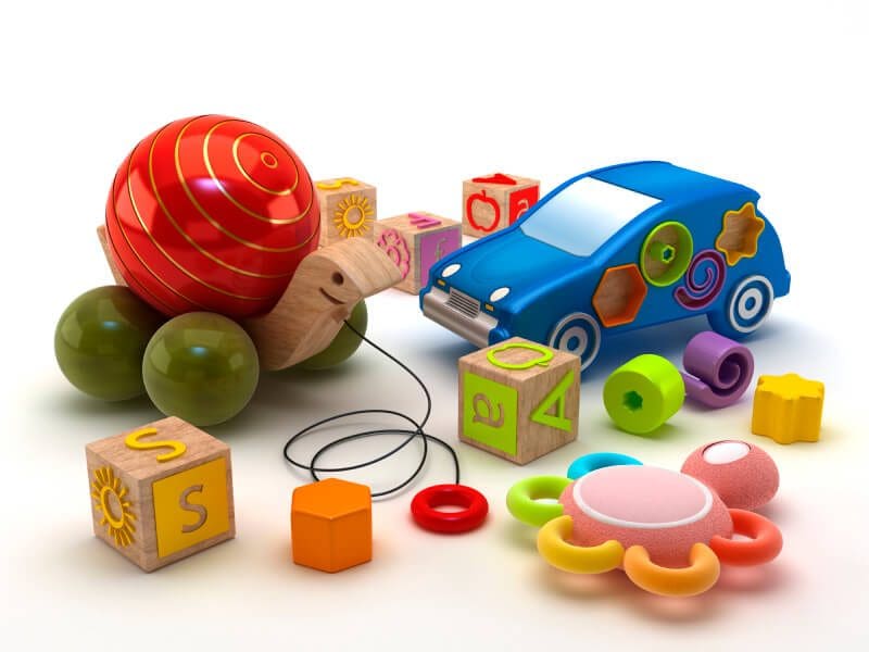 10 Dangerous Toys to Avoid this Christmas 1 Group of child and infant toys including blocks, rattle, and pull toy
