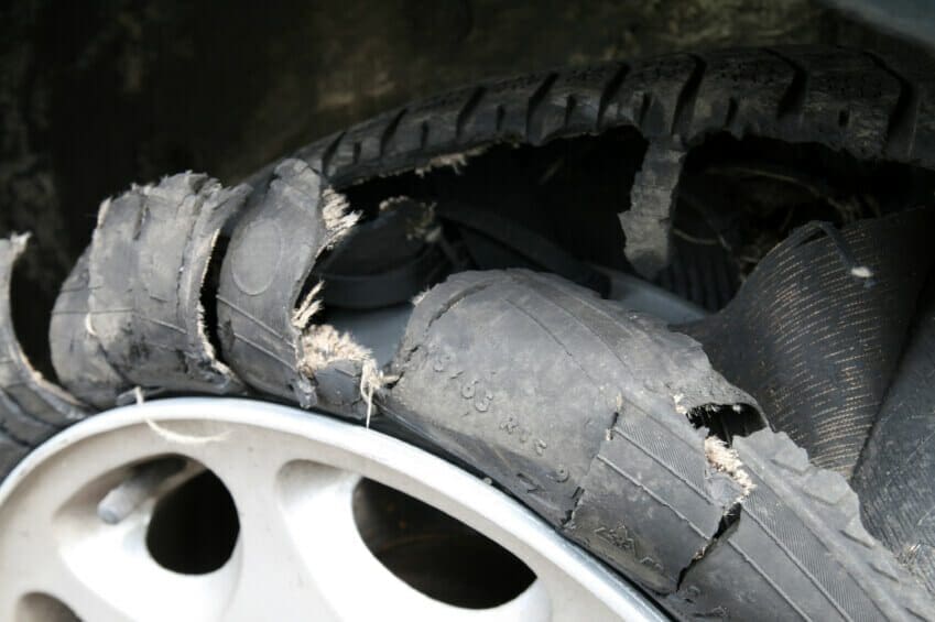 Blog 7 Close up of a destroyed car tire.