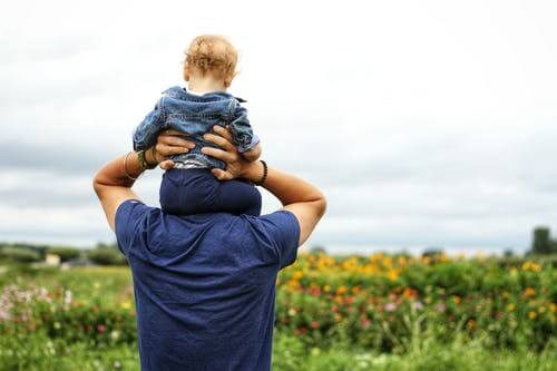 Rear-End Collisions in Texas: Who's Really at Fault? 16 Father holding up child on shoulders in flower field