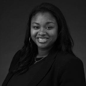 Black and white portrait photo of Thomas J. Henry Attorney Evelyn S. Ogundana