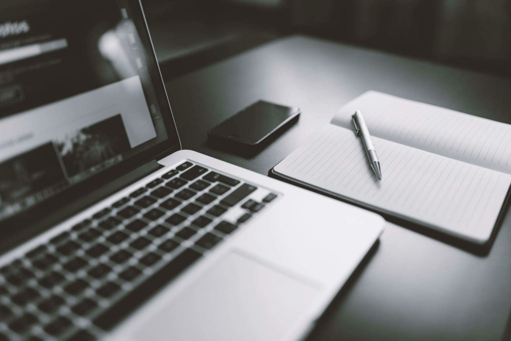 Laptop with pen and pad