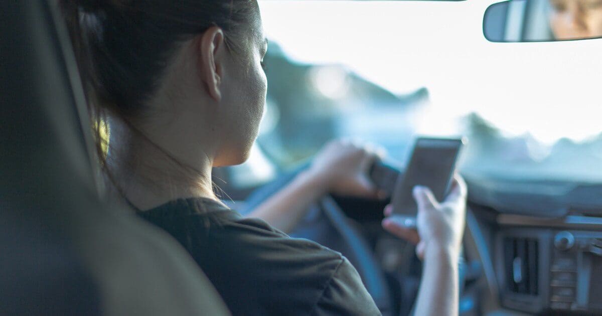 Distracted Driving Accident Lawyers 1 Woman using phone while driving